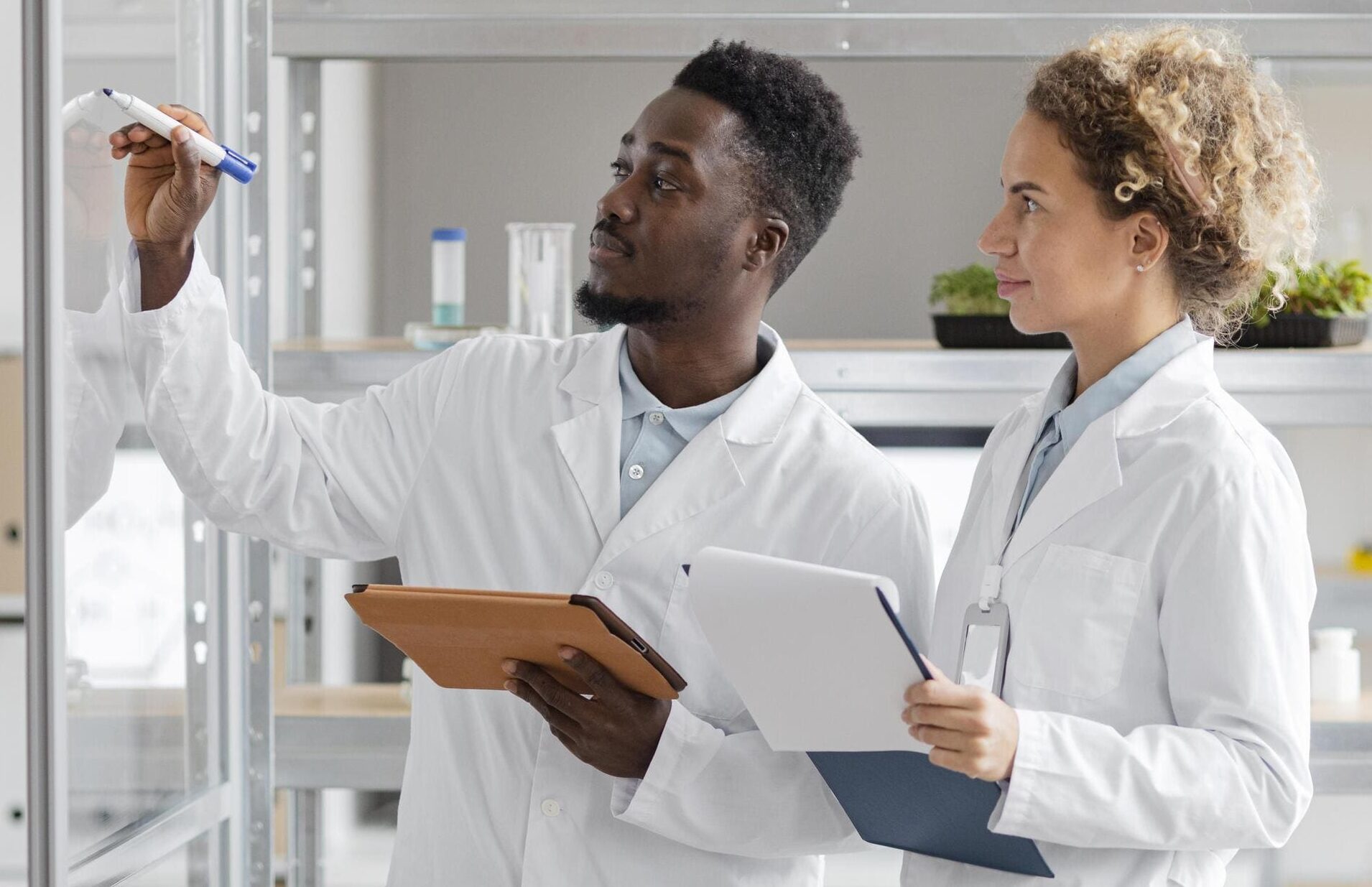 Researchers with tablet clipboard biotechnology laboratory (1) (1)